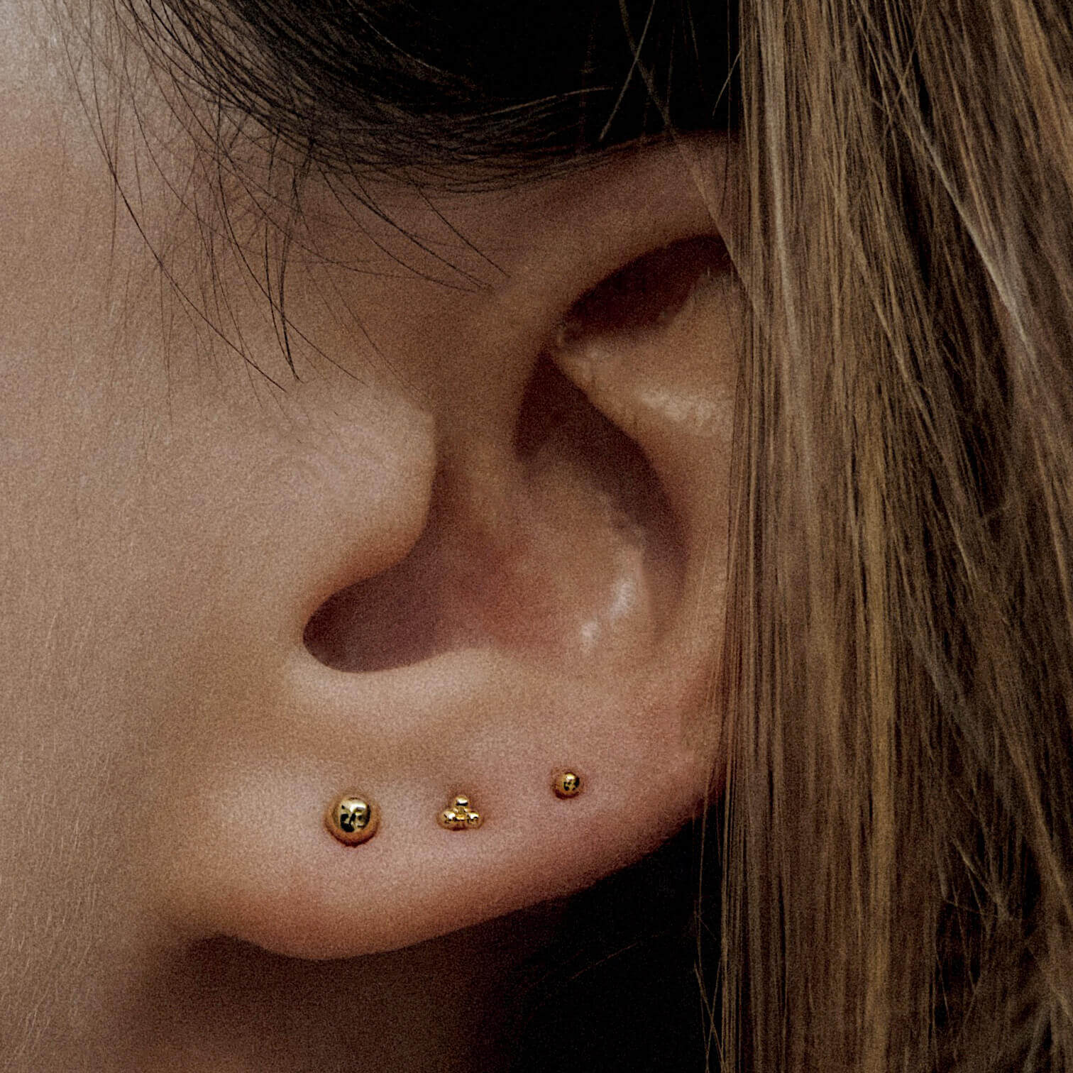 Tiny Trinity Ball Back Earrings in 14k Gold on model