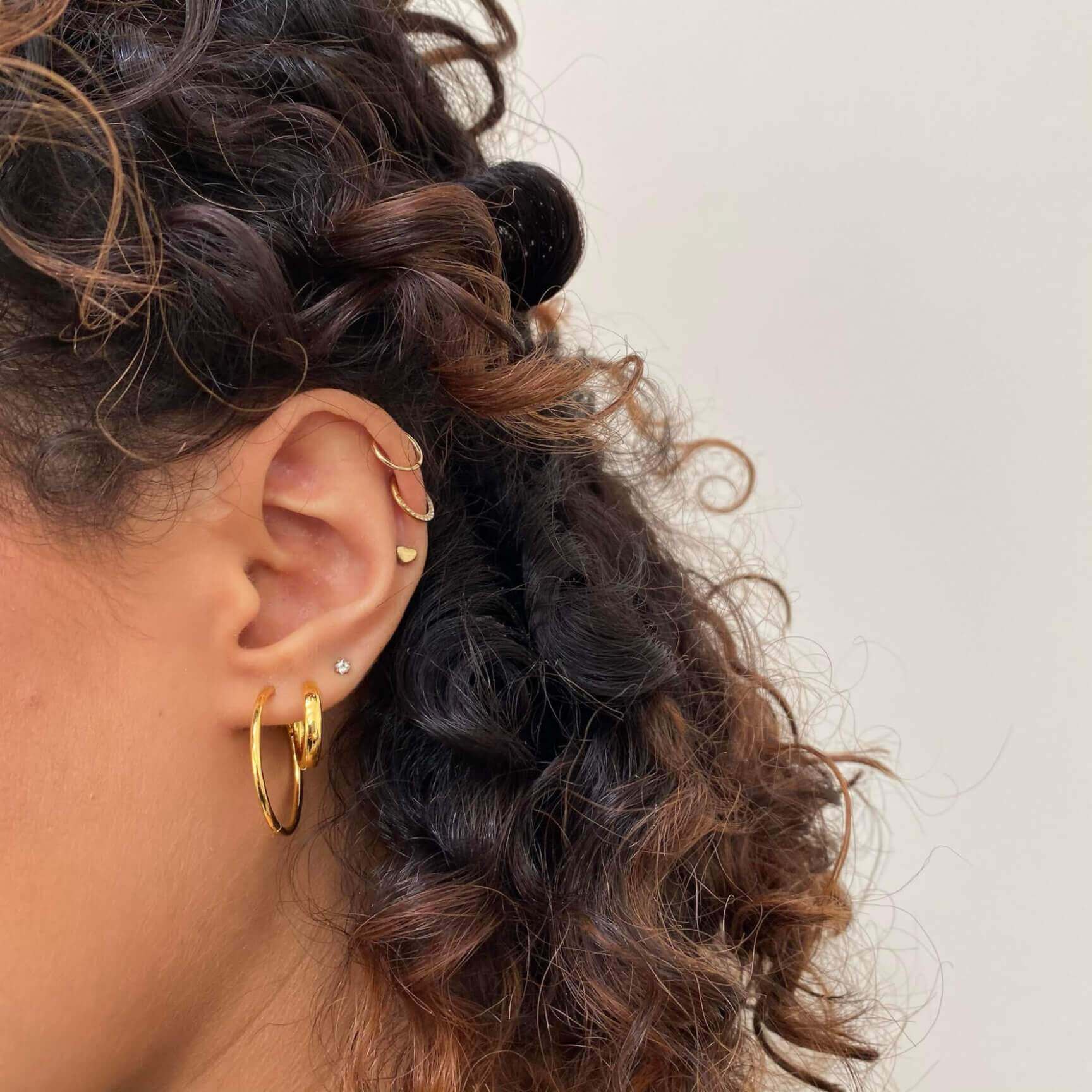 Cosmic Cartilage Hoop in 14k Gold on model
