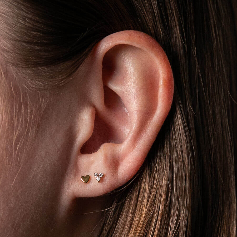 Classic Heart Studs in Titanium (Gold) on model