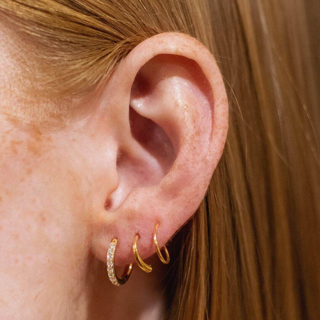 Eternity Hoop Earrings in Titanium (Gold) on model