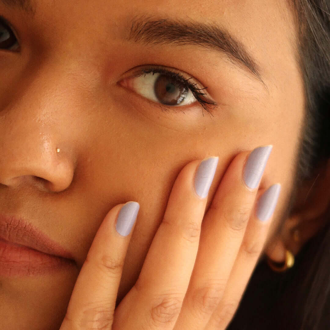 Tiny Diamond Stud L-Shape Nose Ring in 14k Gold on model